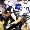 Photo: Antraye Johnson, left, of Basic is tackled by Sam Photo: Antraye Johnson, left, of Basic is tackled by Sam