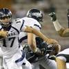 UNR quarterback Cody Fajardo (left) cuts away from Hawaii linebacker Brenden Daley during the Wolf Pack's blowout victory on Saturday, Sept. 22, 2012. The difference in talent in the Mountain West right doesn't get any larger than between these two teams. UNR quarterback Cody Fajardo (left) cuts away from Hawaii linebacker Brenden Daley during the Wolf Pack's blowout victory on Saturday, Sept. 22, 2012. The difference in talent in the Mountain West right doesn't get any larger than between these two teams.