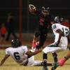 Photo: Las Vegas running back Andrew Moreland leaps over Photo: Las Vegas running back Andrew Moreland leaps over