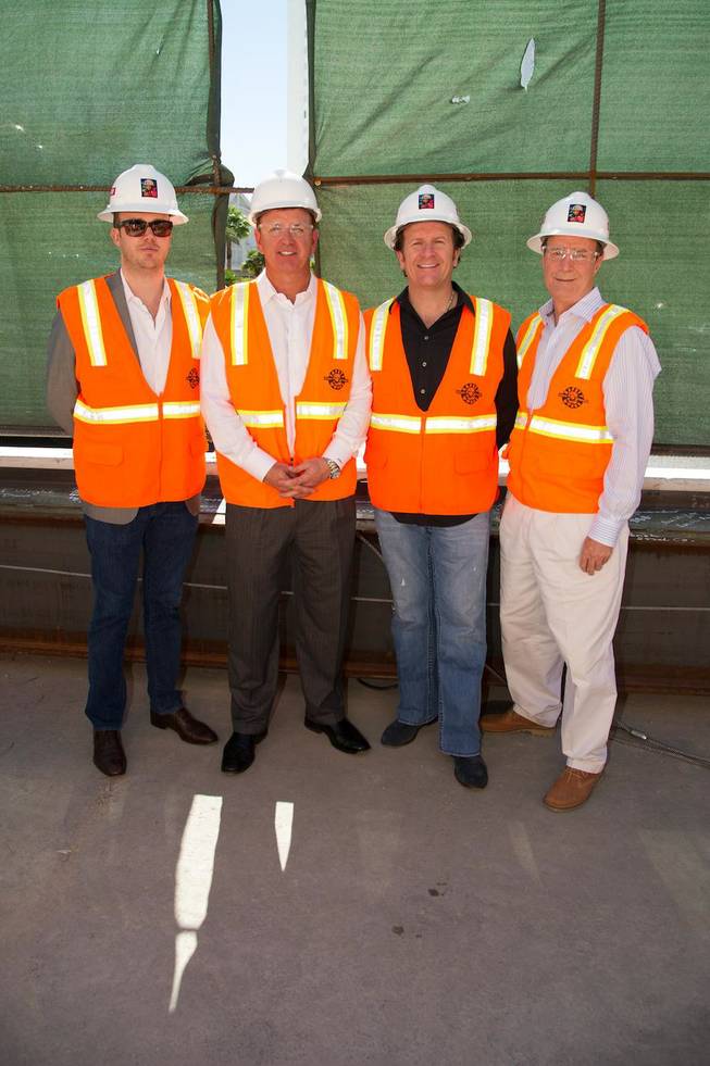 Nick McCabe, VP of Strategy for Angel Management Group, Scott Sibella, president and COO of MGM Grand, Neil Moffitt, CEO of Angel Management Group, and Eric Barth, director of operations for Hakkasan Las Vegas, sign the final construction beam at Hakkasan Las Vegas in MGM Grand on Tuesday, Oct. 9, 2012.
