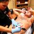 Technician Magdelyn Vasquez-Castro removes a tattoo from the stomach of Brandon Grady at Tattoo Vanish in Las Vegas on Wednesday, October 24, 2012.