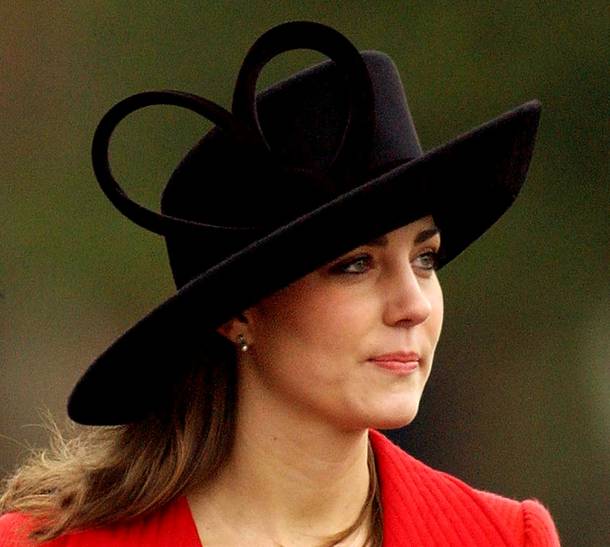 Kate Middleton, a friend of Britain's Prince William wears a hat with a giant heart, as she arrives at the Royal Military Academy, Sandhurst, where graduates, including the Prince, took part in the Sovereign's parade at the academy, near Camberley, England, Friday Dec. 15, 2006. The Prince was commissioned into the Blues and Royals, a regiment of the Household Cavalry.