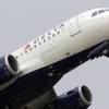 Photo: A Delta Air Lines jet takes off at the Detroit Met Photo: A Delta Air Lines jet takes off at the Detroit Met