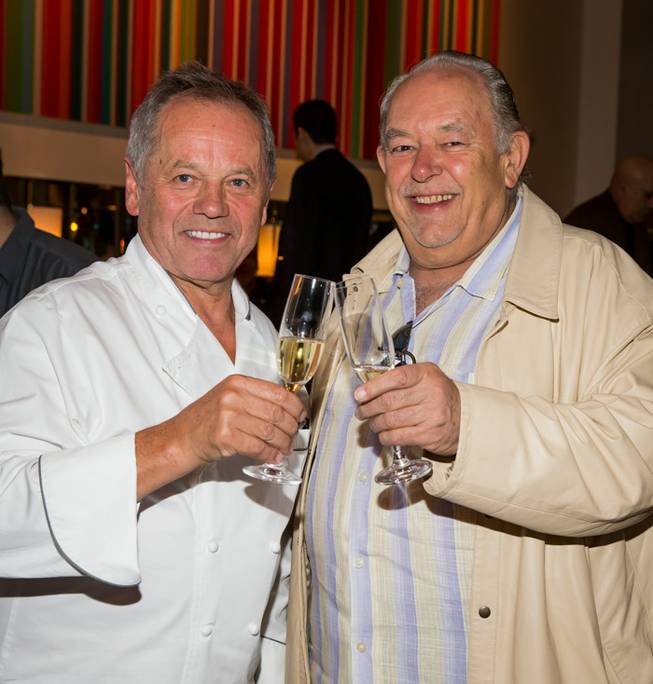 Chef Wolfgang Puck, pictured here with Robin Leach, receives a key to Las Vegas from Mayor Carolyn Goodman as his Spago in the Forum Shops at Caesars Palace celebrates its 20th anniversary on Tuesday, Dec. 11, 2012.