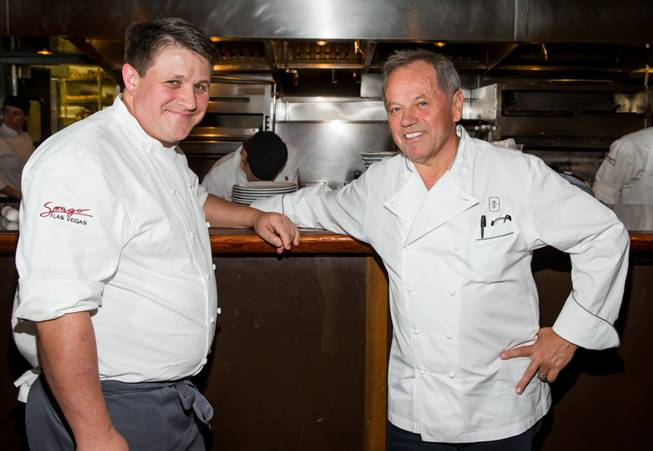 Chef Wolfgang Puck, right, with executive chef Eric Klein, receives a key to Las Vegas from Mayor Carolyn Goodman as his Spago in the Forum Shops at Caesars Palace celebrates its 20th anniversary on Tuesday, Dec. 11, 2012.