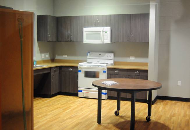 A mock apartment is shown through the classroom door window at Variety's new campus, 2800 East Stewart Ave., on Monday, Jan. 7, 2013. The replacement school features kitchen facilities, a mock apartment and laundry facilities to teach life and vocational skills to special-needs students.