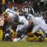 Redskins defensive lineman Barry Cofiled (96), center, on ground, knocks the ball loose from Seahawks runningback Marshawn Lynch, center, on the one yard line and the Redskins recovered the fumble stopping Seattle's opening drive in the third quarter during their NFL playoff football game, Sunday, Jan. 6, 2012, in Landover, Md. Seattle defeated Washington 24-14. Redskins defensive lineman Barry Cofiled (96), center, on ground, knocks the ball loose from Seahawks runningback Marshawn Lynch, center, on the one yard line and the Redskins recovered the fumble stopping Seattle's opening drive in the third quarter during their NFL playoff football game, Sunday, Jan. 6, 2012, in Landover, Md. Seattle defeated Washington 24-14.