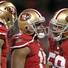 San Francisco 49ers wide receiver Michael Crabtree (15), center, is congratulated after scoring a touchdown with quarterback Colin Kaepernick, left, and guard Jonathan Goodwin (59) against the Green Bay Packers in an NFC divisional playoff NFL football game in San Francisco, Saturday, Jan. 12, 2013. San Francisco 49ers wide receiver Michael Crabtree (15), center, is congratulated after scoring a touchdown with quarterback Colin Kaepernick, left, and guard Jonathan Goodwin (59) against the Green Bay Packers in an NFC divisional playoff NFL football game in San Francisco, Saturday, Jan. 12, 2013.