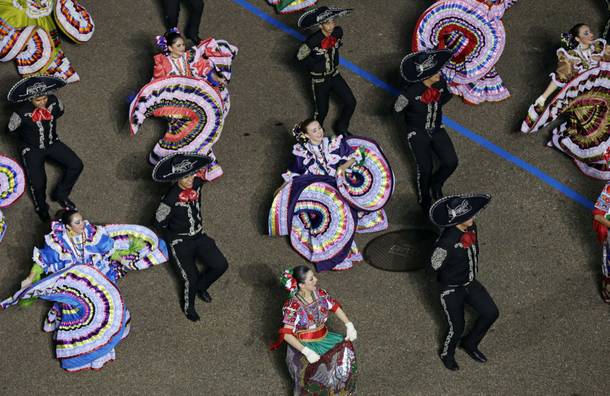 Palmview High School Mariachi and Folkloric Group, Texas dance down Pennsylvania Avenue en route to the White House, Monday, Jan. 21, 2013, in Washington. Thousands marched during the 57th Presidential Inauguration parade after the ceremonial swearing-in of President Barack Obama.