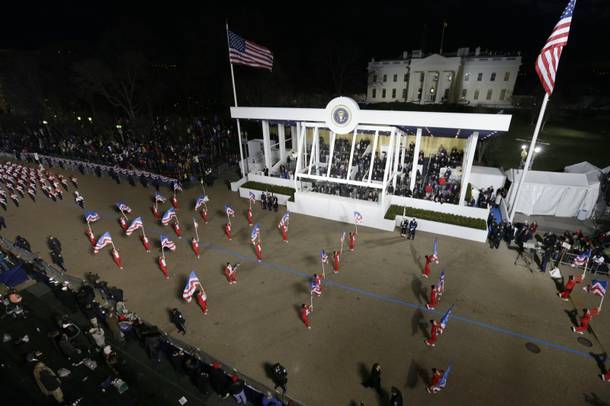 Boston Crusaders Drum & Bugle Corps, Massachusetts perform while passing the presidential box and the White House during the Inaugural parade , Monday, Jan. 21, 2013, in Washington. Thousands marched during the 57th Presidential Inauguration parade after the ceremonial swearing-in of President Barack Obama.
