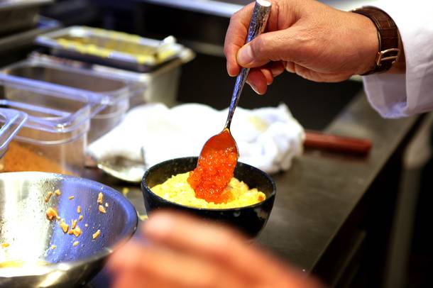 Chef Nobu Matsuhisa cooks egg donburi at the new Nobu Restaurant at Caesars Palace in Las Vegas on Friday, February 1, 2013.