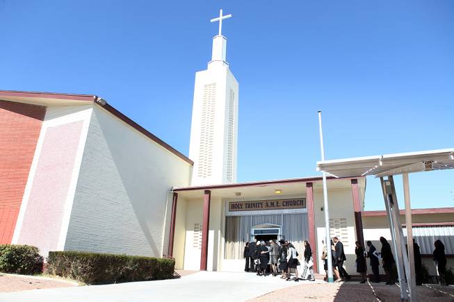 Family members and friends of Michael Boldon enter the church before the memorial service for Michael Boldon at Holy Trinity AME Church in North Las Vegas on Wednesday, Feb. 27, 2013. Boldon was killed in his cab Feb. 21, the result of a fiery crash after a shootout on the Las Vegas Strip.