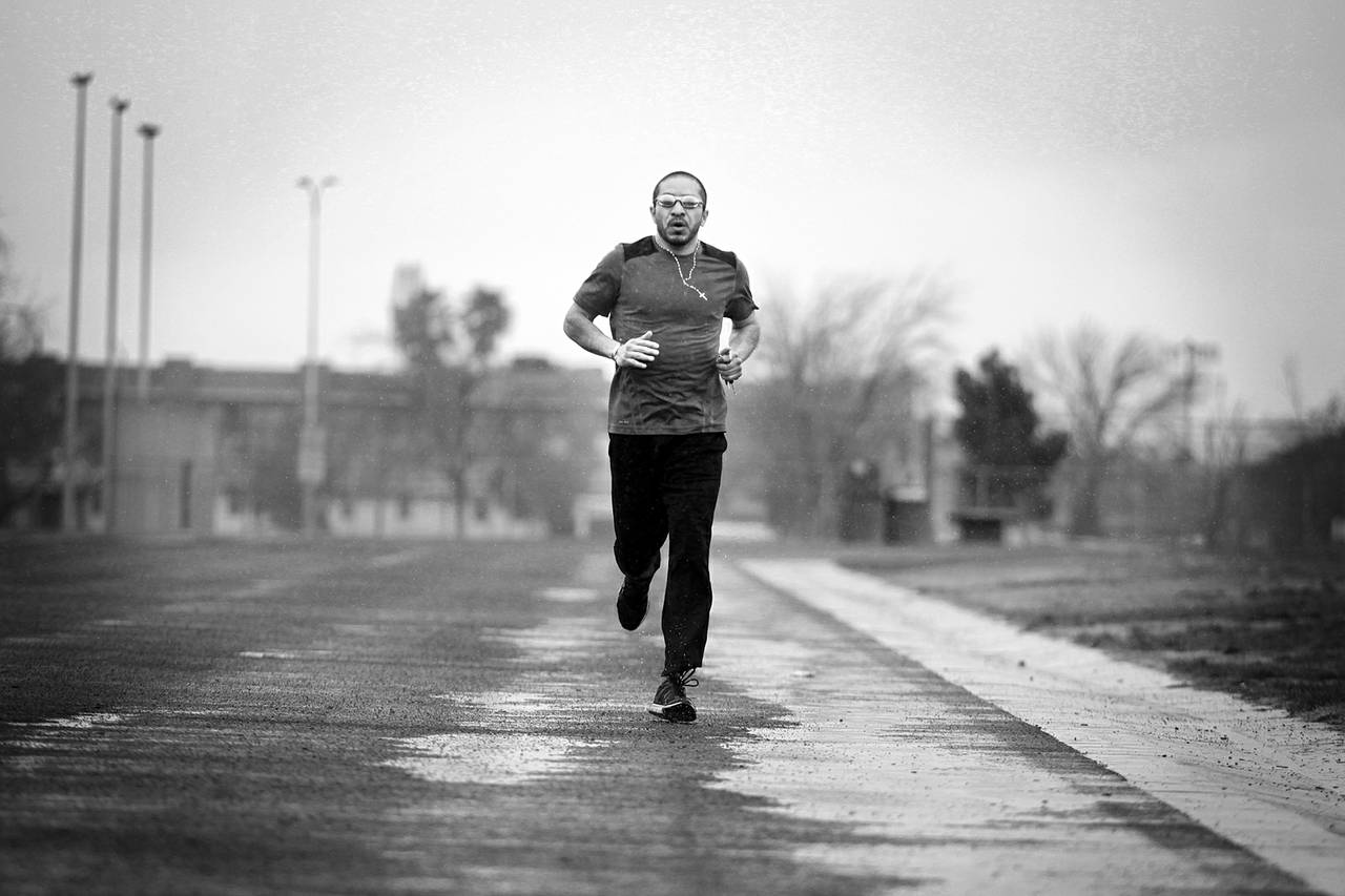 Arturo Martinez-Sanchez runs on a track at the Cheyenne Sports Complex in North Las Vegas on the morning of March 8, 2013. Because of a traumatic brain injury in April 2012, he has only recently begun running again.