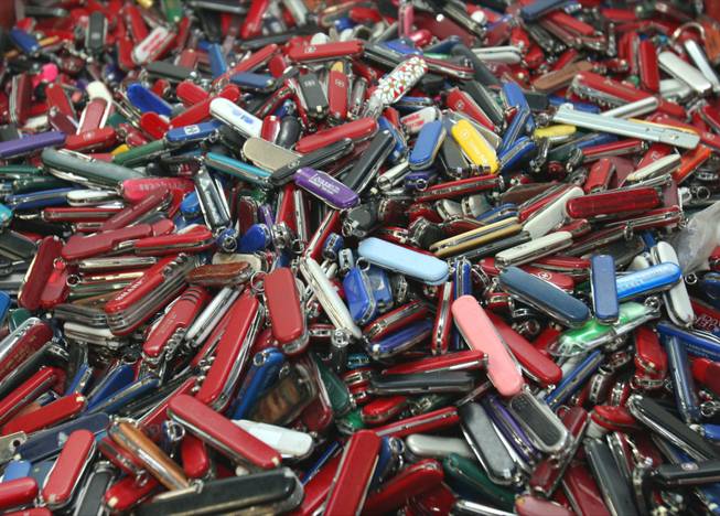 In this Sept. 26, 2006, file photo, knives of all sizes and types are piled in a box at the Georgia Surplus Property Division store in Tucker, Ga., and are just a few of the hundreds of items discarded at the security checkpoints of Hartsfield-Jackson Atlanta International Airport that will be for sale at the store.
