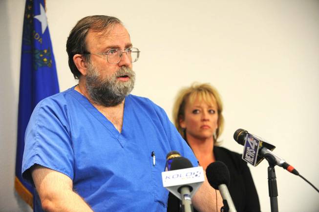 Renown Medical Center emergency room doctor Michael Morkin talks about treating the wounded from Monday night's deadly explosion in Hawthorne that took the lives of seven Marines, during a press conference in Reno, Nev., Tuesday, March 19, 2013. Behind him is Kris Gaw, Chief Operating Officer, Renown Regional Medical Center. Morkin said that the Air Races crash in 2011 helped with the situation in the ER Monday night and Tuesday morning.