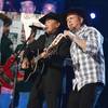 George Strait and Garth Brooks perform during the 2013 Academy of Country Music Awards at MGM Grand Garden Arena on Sunday, April 7, 2013. George Strait and Garth Brooks perform during the 2013 Academy of Country Music Awards at MGM Grand Garden Arena on Sunday, April 7, 2013.