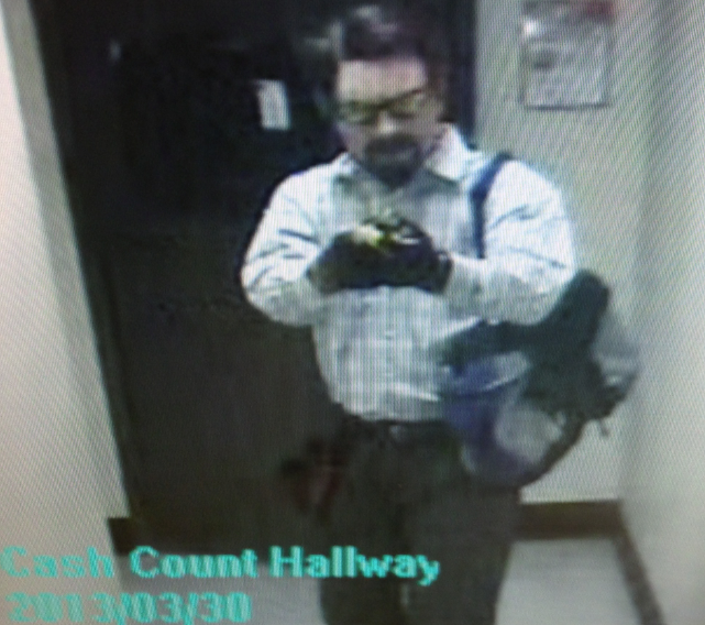 Las Vegas Metro Police released this surveillance photo Monday afternoon of a suspect in the March 30 robbery of a business near the intersection of South Las Vegas Boulevard and Sands Avenue. Police said the man in the photo entered the back office of the business and pointed a gun at an employee and instructed the employee to take the cash out of the safe and place it into a duffel bag the suspect was carrying.