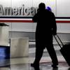 Photo: In this Nov. 29, 2011, file photo, a passenger wal Photo: In this Nov. 29, 2011, file photo, a passenger wal