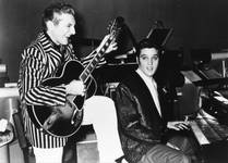 Liberace, the piano virtuoso who became known as "Mr. Showmanship," is shown with Elvis Presley at the Riviera in Las Vegas in November 1956. Liberace, the piano virtuoso who became known as "Mr. Showmanship," is shown with Elvis Presley at the Riviera in Las Vegas in November 1956.