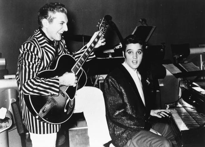 Liberace, the piano virtuoso who became known as "Mr. Showmanship," is shown with Elvis Presley at the Riviera in Las Vegas in November 1956.