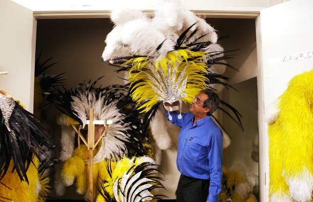 Marios Ignadiou. head of the Jubilee! costume shop, holds up a headpiece from the Disco number at Bally's in Las Vegas on Tuesday, June 11, 2013.