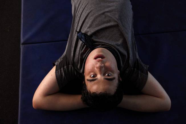 Ido Kedar, who is a non-verbal autistic teenager, takes a breather while working out at a local high school in West Hills, Calif., on Nov. 4, 2013. Kedar doesn't play sports, but his parents try to keep him in shape by having him work out with a special fitness instructor. He is also the author of the book, "Ido in Autismland - Climbing Out of Autism's Silent Prison," which was published in 2012.
