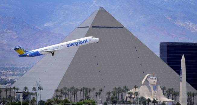 In this Thursday, May 9, 2013, photo, An Allegiant Air jetliner flys by the Luxor Resort & Casino after taking off from McCarran International Airport in Las Vegas. While other U.S. airlines have struggled with the ups and downs of the economy and oil prices, tiny Allegiant Air has been profitable for 10 straight years.