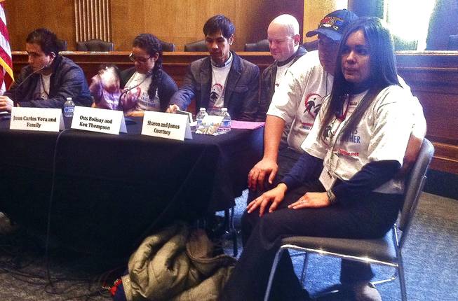Sharon Courtney, right, sits next to her husband James listening to other undocumented immigrants share their personal stories. The Las Vegas couple came to Capitol Hill for an immigration rally at the Dirksen Senate Office Building to testify about their experience living with the threat of deportation looming over Sharon, March 13, 2013.