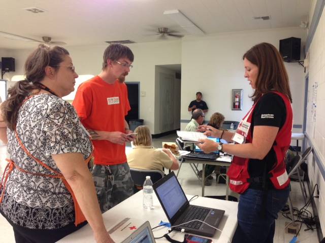Teresa Awkeman, specialty manager at the Home Depot in Pahrump and Herb Dinardi, department supervisor at the Home Depot at 9705 W Charleston Blvd.
in Las Vegas, work with Jennifer Ramieh, a spokeswoman for the Southern Nevada Chapter of the American Red Cross, to donate water for Mount Charleston wildfire evacuation shelters on July 5, 2013.