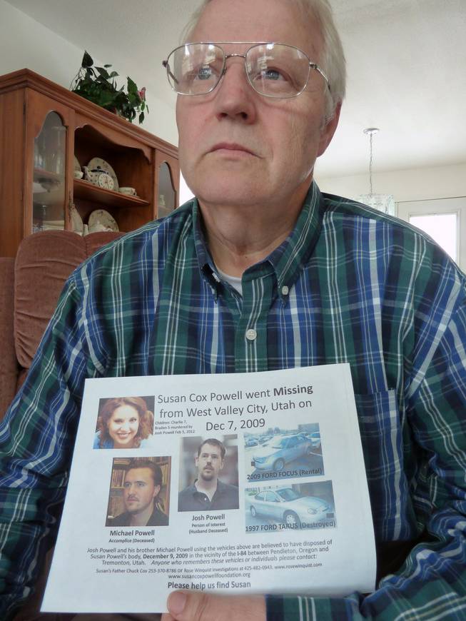 Chuck Cox holds a poster seeking information in the 2009 disappearance of his daughter, Susan Powell. Police have suspended their case with the death of Powell's husband, who killed himself and their children, but Cox is still searching. He is shown at home in Puyallup, Washington, in July 2013. (John M. Glionna/Los Angeles Times/MCT)