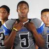 Photo: Basic High football players (from left) Pale Laulu Photo: Basic High football players (from left) Pale Laulu