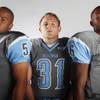 Photo: Centennial High School football players (from left Photo: Centennial High School football players (from left