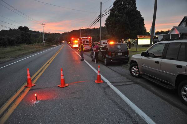Emergency crews respond to a reported shooting at the Ross Township building that left two people dead, Monday, Aug. 5, 2013 in Saylorsburg, Pa. Monroe County emergency management director Guy Miller says the shooting happened Monday evening during Ross Township's regular monthly meeting. He says the gunman has been captured and is in state police custody.