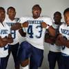 Photo: Canyon Springs football players, from left, defens Photo: Canyon Springs football players, from left, defens