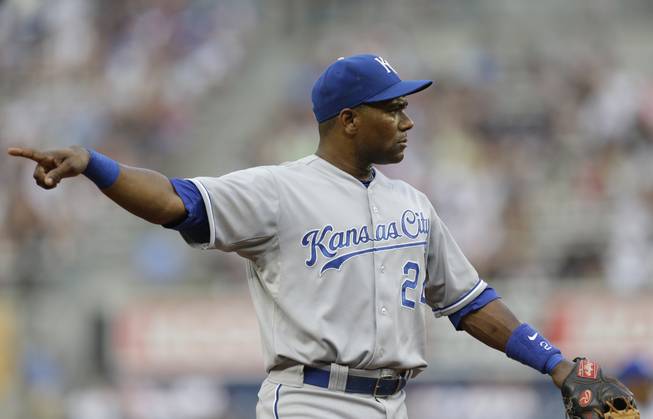 In this July 9, 2013, file photo, Kansas City Royals shortstop Miguel Tejada points to the third base umpire, who ruled a strikeout in a game in New York. Tejada was suspended for 105 games for testing positive for amphetamines, the MLB announced in a statement Saturday, Aug. 17, 2013.
