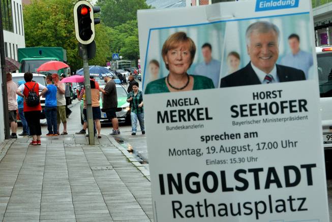 A poster for an election campaign is seen in the city center of Ingolstadt, Germany, 19 August 2013. The campaign appeararance by German Chancellor Angela Merkel and the Bavarian Prime Minister Horst Seehofer at the Town Hall Square has been canceled due to a hostage-taking. A man has taken several hostages in the city hall of Ingolstadt.