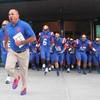 Photo: Bishop Gorman coach Tony Sanchez leads his Gaels o Photo: Bishop Gorman coach Tony Sanchez leads his Gaels o