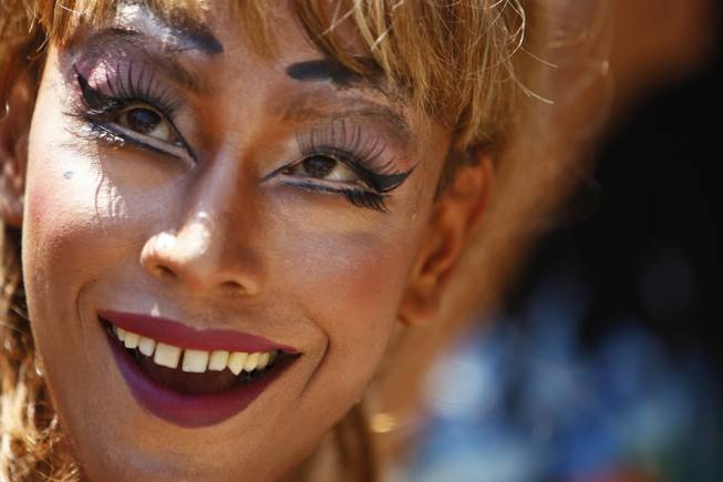 A participant smiles in a Gay Pride rally in Katmandu, Nepal, Thursday, Aug. 22, 2013. About 1,000 people, including gays, lesbians, transvestites and their supporters hold the rally that has now become an annual festival for sexual minorities to celebrate and to demand rights for their community. Organizers said the rally was an opportunity for the sexual minorities to come out in the open and also to educate the public.