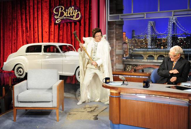 In this Aug. 29, 2013 photo provided by CBS, actor Bill Murray, left, joins host David Letterman on the set of the Late Show with David Letterman, in New York, as the show celebrates its 20th Anniversary on Thursday, Aug. 39. Murray was the Late Show's first guest 20 years ago and retrieved a time capsule as part of the festivities. The show airs Thursday, Aug. 29.