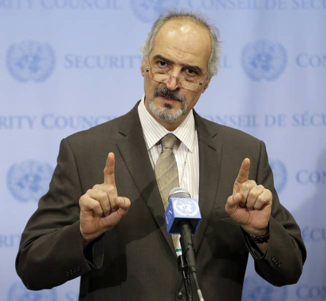 Syrian Ambassador to the United Nations Bashar Ja'afari speaks to reporters after a meeting about Syria at United Nations headquarters Wednesday, Aug. 28, 2013. The five permanent members of the U.N. Security Council met informally to discuss the language of a draft resolution that would authorize the use of military force against Syria.