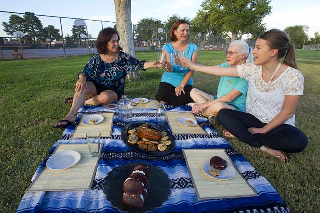 Supporters of raw milk toast with empty glasses during a "picnic" at Sunset Park Thursday, August 29, 2013. From left are: Patricia Aiken, Emily McFarling, Caroline Anaya, and Juliana Whitney. The Nevada legislature passed a bill that would have allowed raw milk produced in Nye County to be distributed statewide but Governor Brian Sandoval vetoed the bill.
