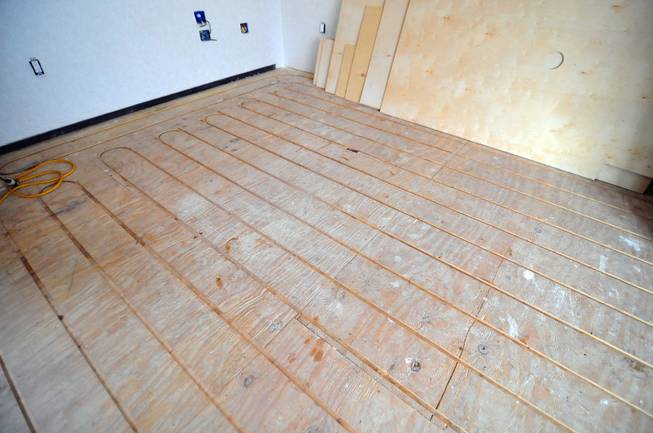 A half-completed hydronic-radiant heated floor is shown here at UNLV's Desert Sol project, a solar house that will operate entirely on renewable energy, on Friday, August 30, 2013. Desert Sol will travel to Irvine, Calif., in September to compete against 19 other teams from around the world in the U.S. Department of Energy's Solar Decathlon competition.