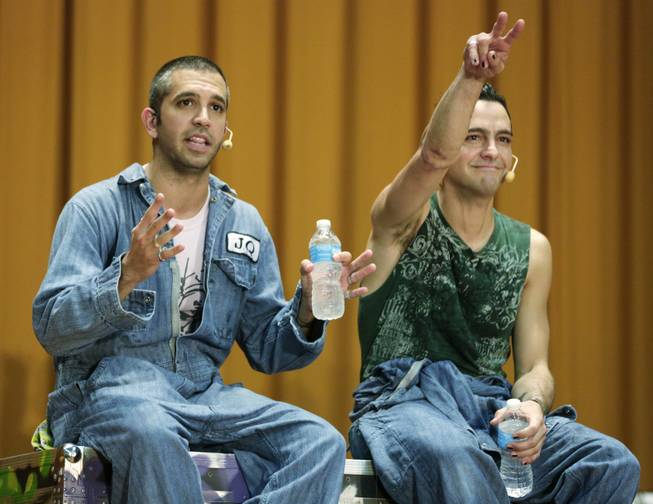 In this Aug. 27, 2013, photo, brothers and rappers JQ and GQ, aka Gregory and Jeffrey Qaiyum, who wrote and directed a hip hop adaptation of William Shakespeare's Othello, titled "Othello: The Remix" take questions from inmates at the Cook County Jail after performing their 70 minute show for about 450 inmates at the jail in Chicago.