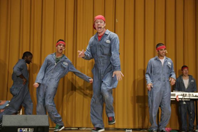In this Aug. 27, 2013, photo, rappers perform a hip hop adaptation of William Shakespeare's Othello, titled "Othello: The Remix" at the Cook County Jail in Chicago. This new Othello - originally commissioned by Shakespeare's Globe Theater - has been performed in England, South Korea and Chicago.