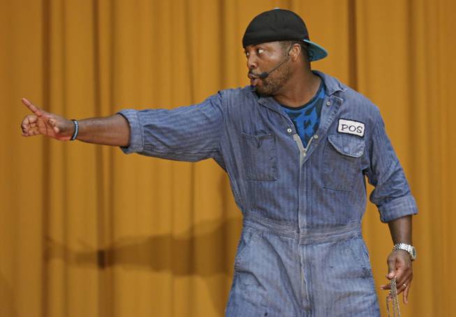 In this Aug. 27, 2013, photo, rapper Postell Pringle performs in a hip hop adaptation of William Shakespeare's Othello, titled "Othello: The Remix" at the Cook County Jail in Chicago. The Q Brothers and Chicago Shakespeare Theater brought the the 70-minute adaptation of William Shakespeare's tragedy to perform for about 450 inmates.