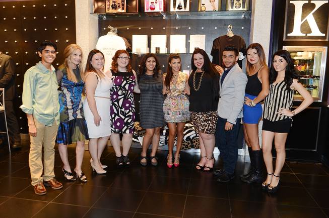 Cici Bussey, second from left, and Kourtney Kardashian, fifth from right, with Kardashian Khaos Kuties at Kardashian Khaos in the Mirage on Saturday, Aug. 31, 2013.