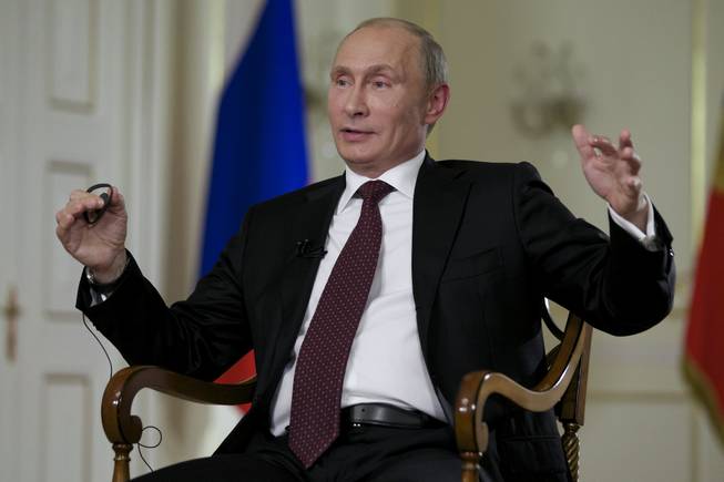 Russian President Vladimir Putin gestures while speaking to John Daniszewski, the Associated Press's senior managing editor for international news, during an AP interview at Putin's Novo-Ogaryovo residence outside Moscow, Russia, Tuesday, Sept. 3, 2013. Putin sought to downplay the current chill in the U.S.-Russian relations and said that the two countries need to cooperate on a range of issues in the interests of global stability.