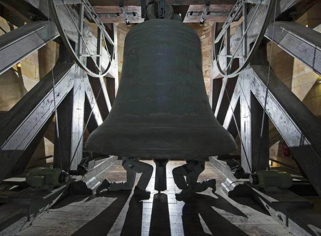 Workers inspect the material during the annual planned maintenance at the Gloriosa bell in the Mariendom (Cathedral of Mary) in Erfurt, central Germany, Wednesday, Sept. 4, 2013. The Gloriosa is the largest freely swinging medieval bell in the whole world. The tulip-shaped bell, which is 2,57 metres in diameter, 2,47 metres high and weighs 11,450 kgs, was cast in the courtyard of St Severus by master Gherardus de Wou of Kampen, Netherlands, in the night of 7 to 8 July 1497.