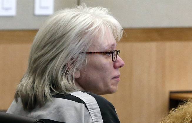 In this Aug. 1, 2013, file photo, Debra Jean Milke listens to a judge during a hearing as she awaits a retrial in the 1989 shooting death of her 4-year-old son, Christopher, at Maricopa County Superior Court in Phoenix. A judge is allowing Milke to be released on bail as she awaits retrial in the 1989 killing of her young son, a case that had her on death row since 1990 until her conviction was overturned this year.