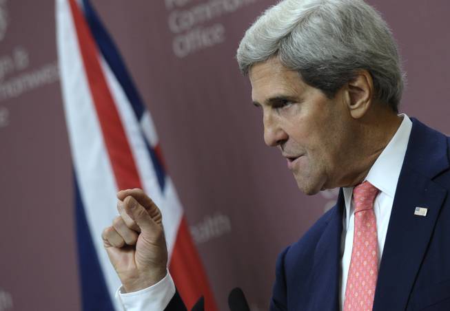 U.S. Secretary of State John Kerry speaks during a news conference with Britain's Foreign Minister William Hague at the Foreign and Commonwealth Office in London, Monday, Sept. 9, 2013. Kerry said Syria's President Bashar Assad could resolve the crisis surrounding a chemical weapons attack simply by turning over "every single bit" of his weapons stock to the international community within a week.